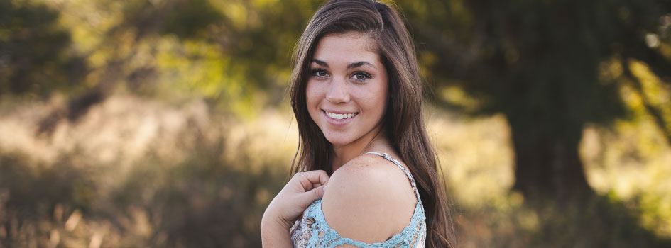 girl smiling with straight, white teeth